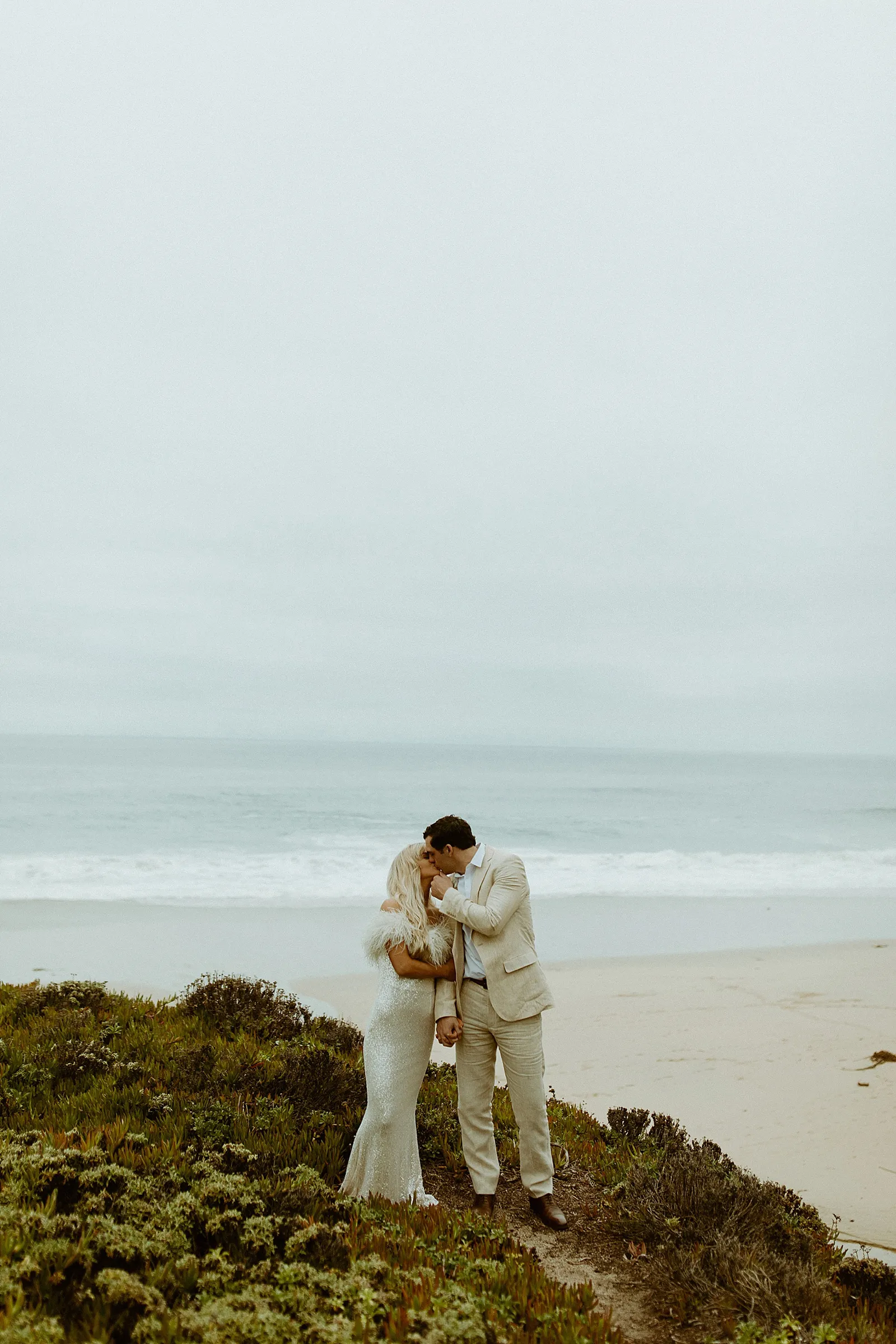 couple kissing on beach