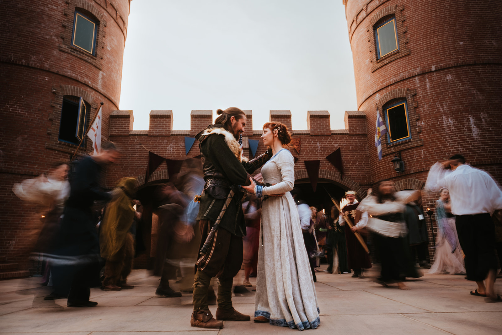 Bride and groom dancing while people dance