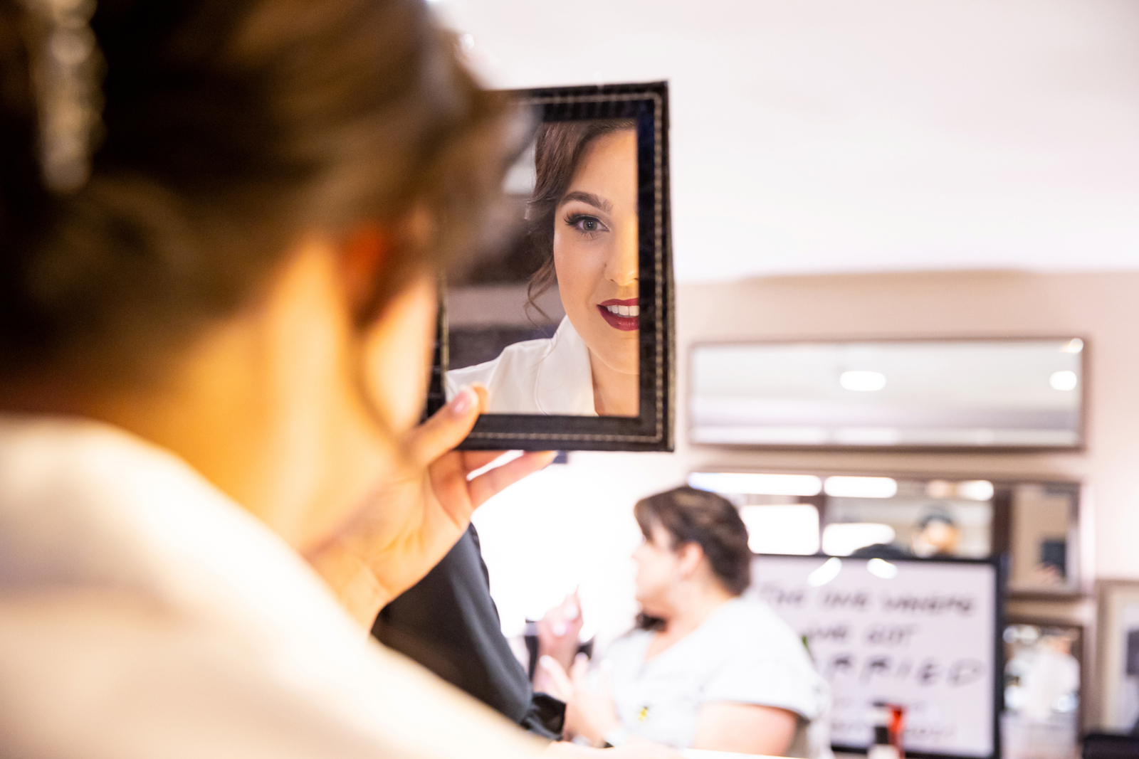 Bride to be getting makeup done by All Dolled Up