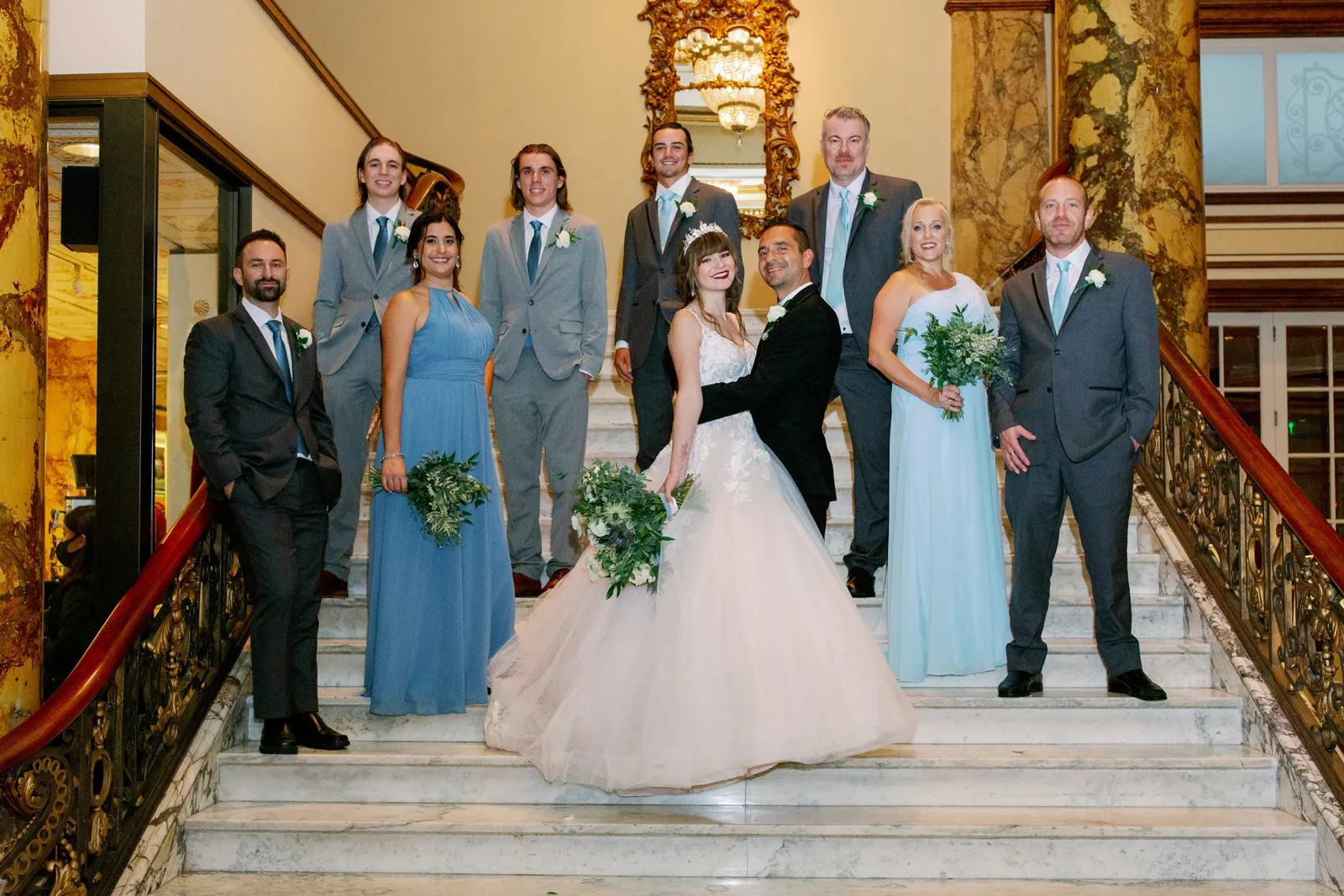 Bride and Groom taking photos with family