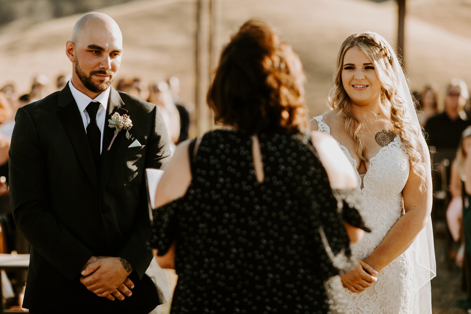 Officiant speaking to bride and groom