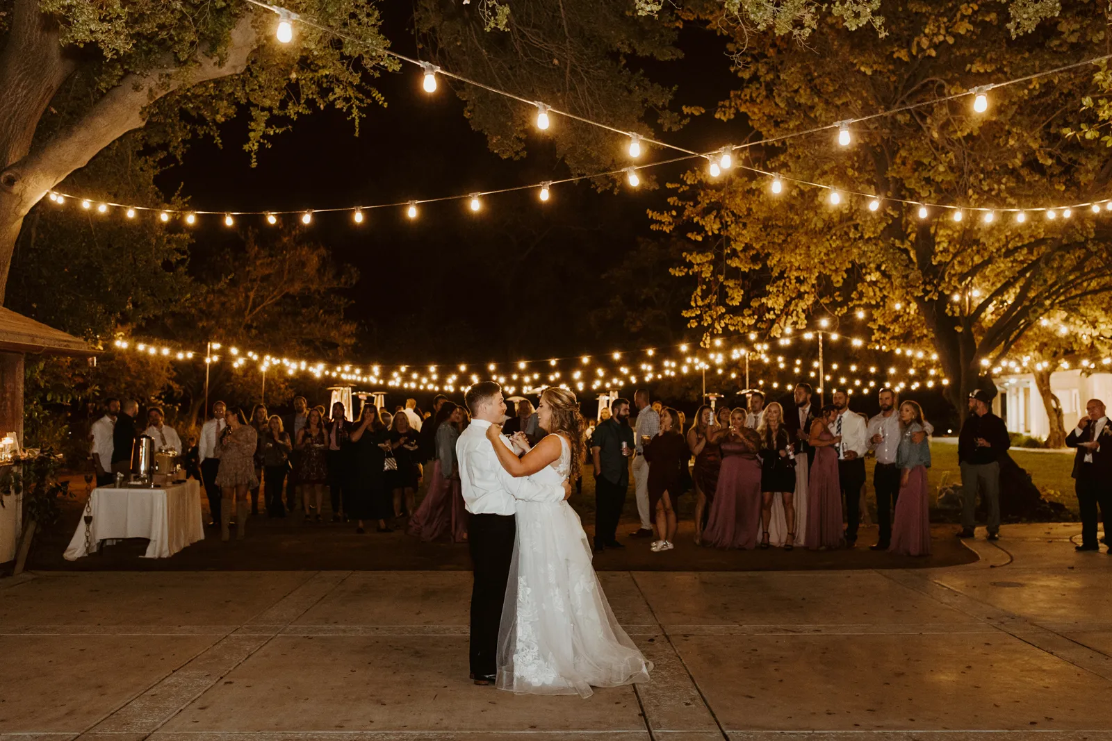 Bride and groom dancing on dancefloor.