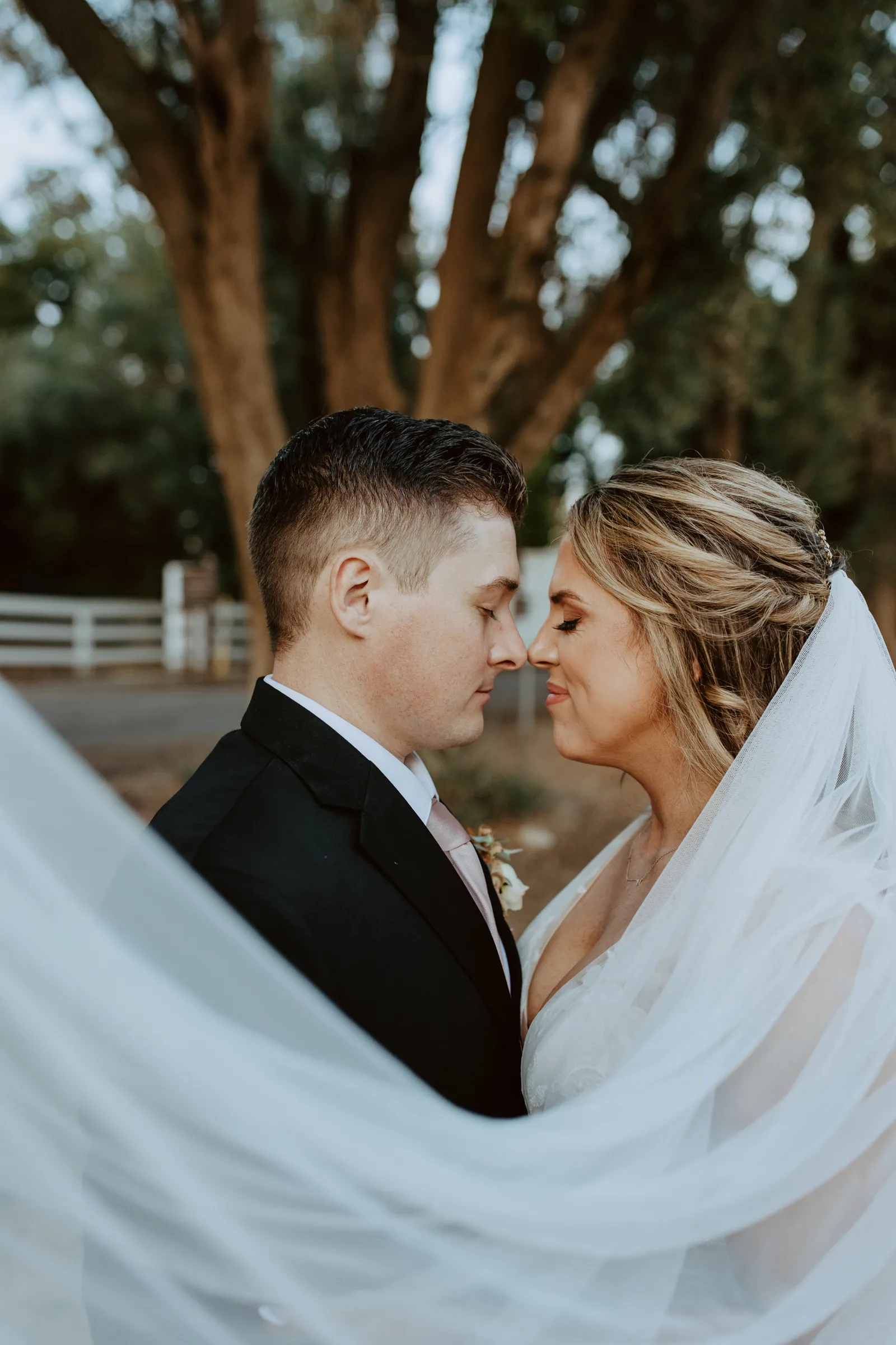 Bride and groom smiling at each other