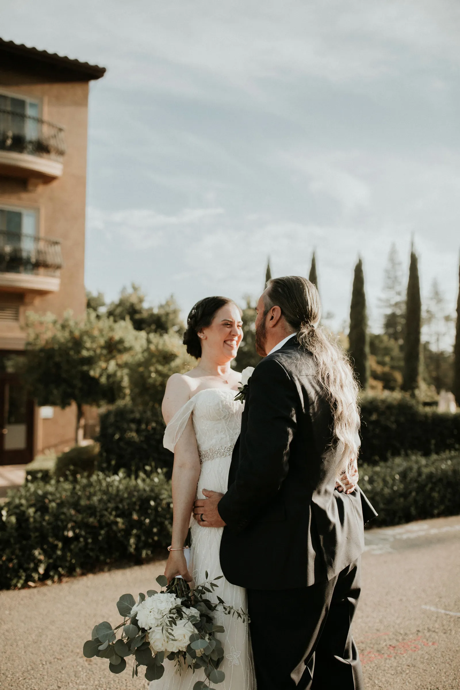 Bride and groom looking at each other