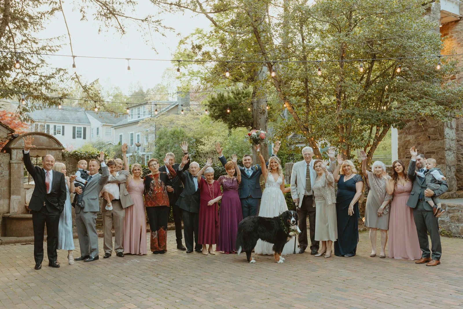 Family photo of the wedding party and family outside after the wedding ceremony.