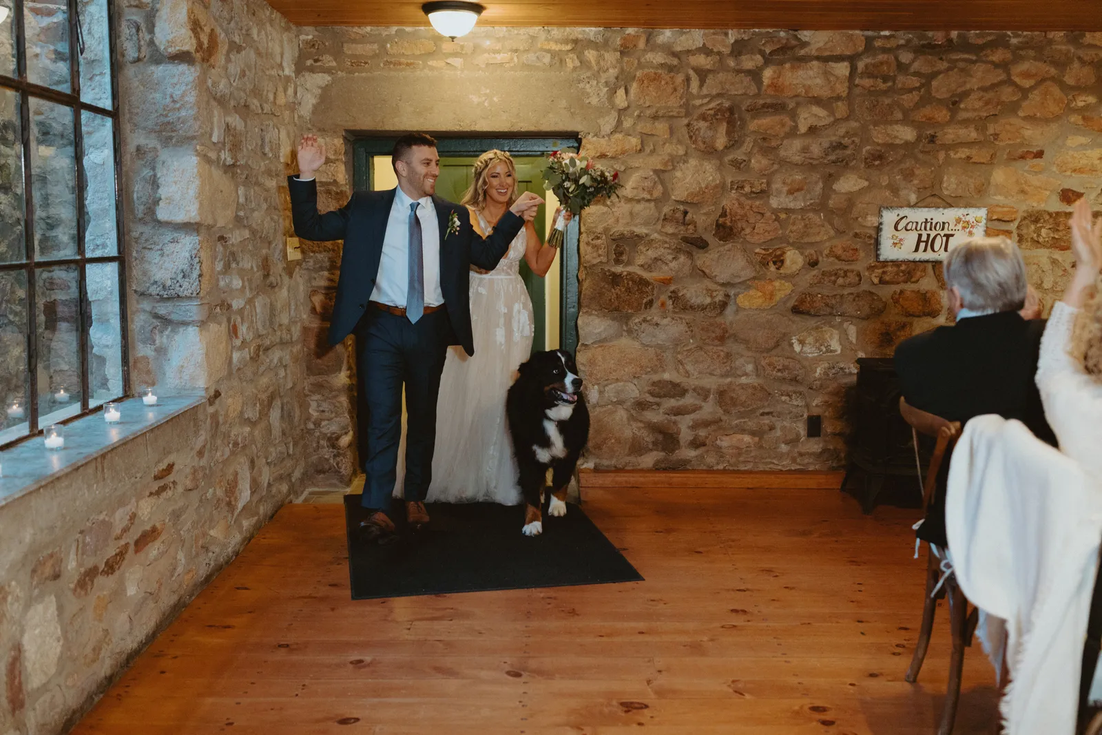 Newlyweds walking inside for their reception.