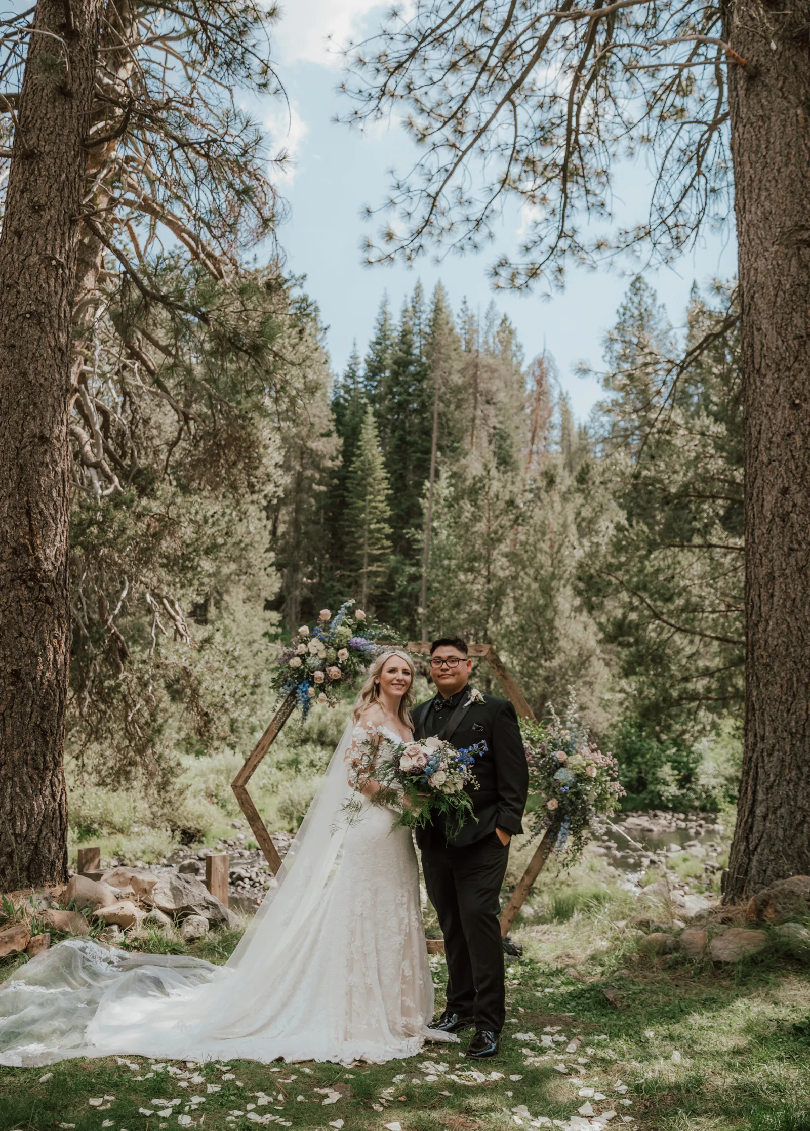 Bride and groom smiling at the altar for photos