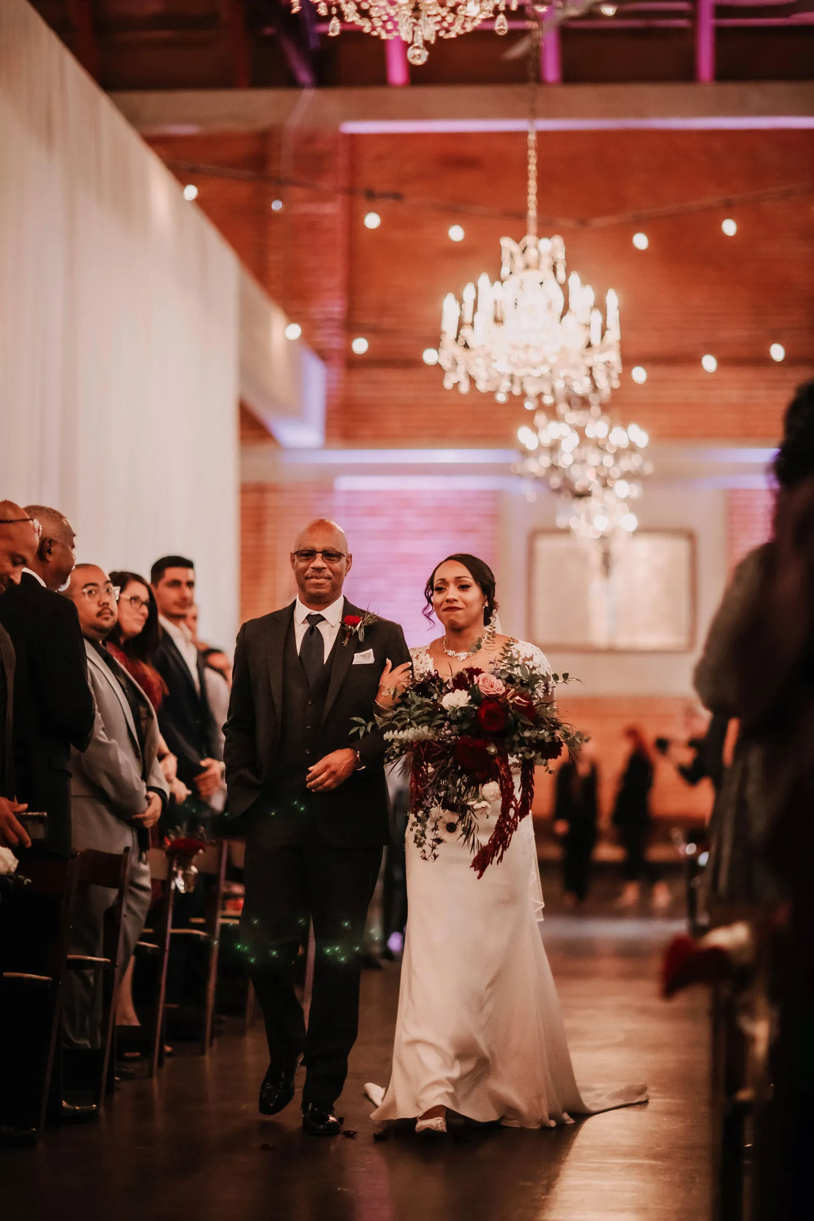 Father walking his daughter down the aisle.