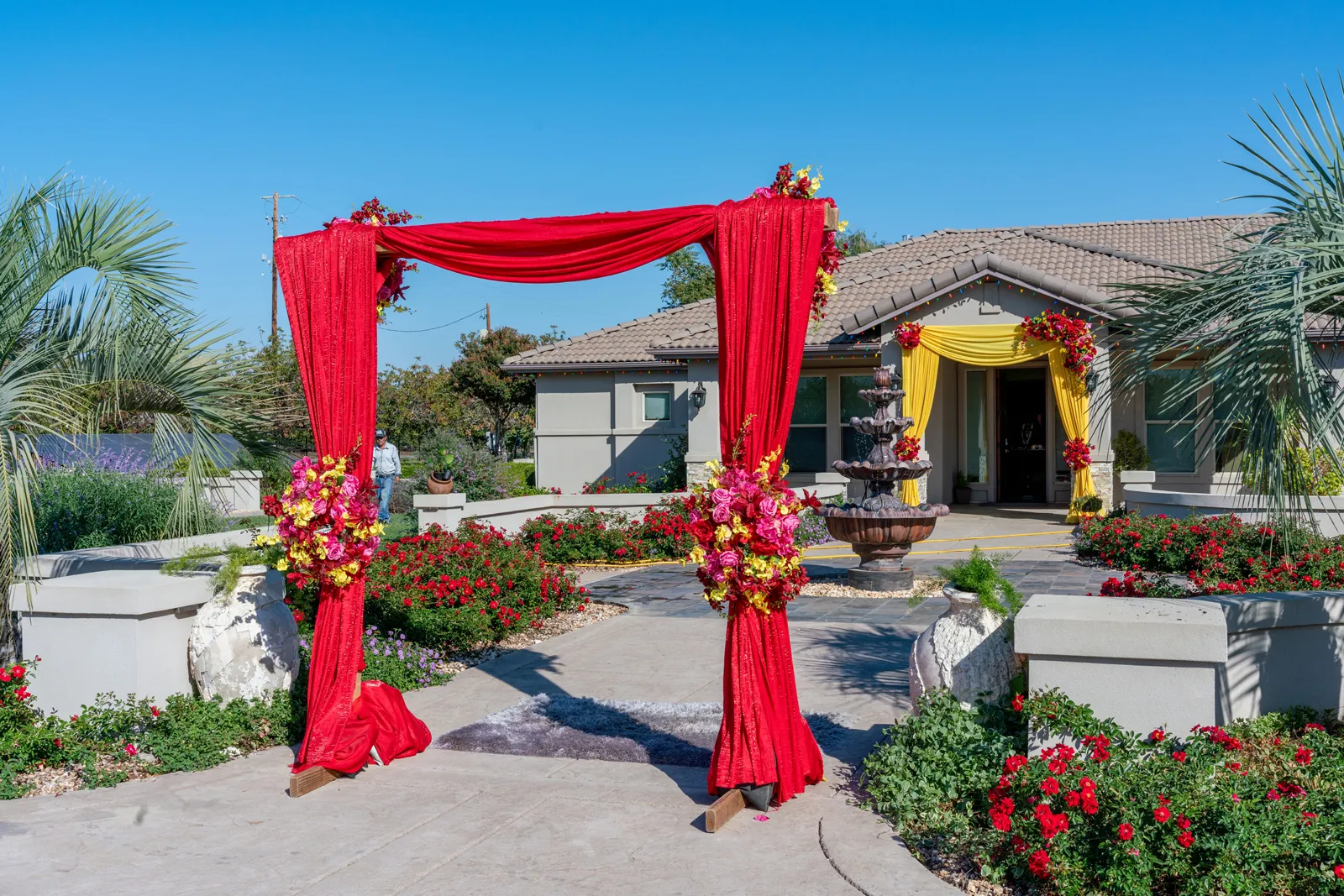 Two large arches set up in front of a house.