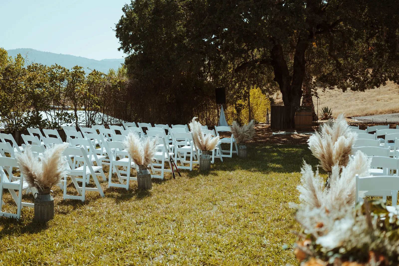 Cobble Creek Ranch wedding venue with chairs set up alongside the aisle.