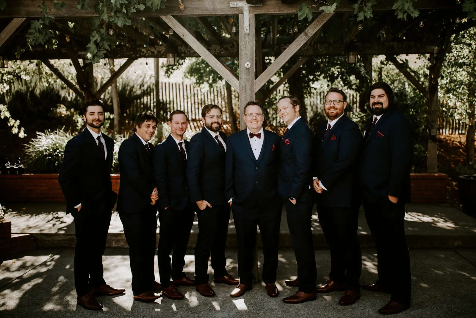 Groom and groomsmen posing together.