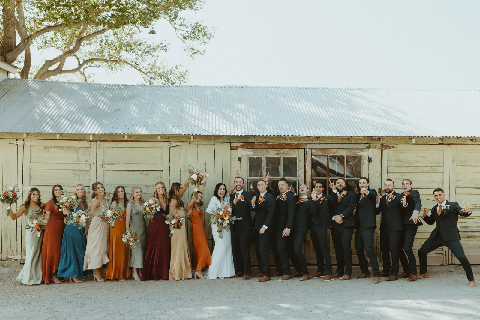 Bridal party all smiling and posing for photos.