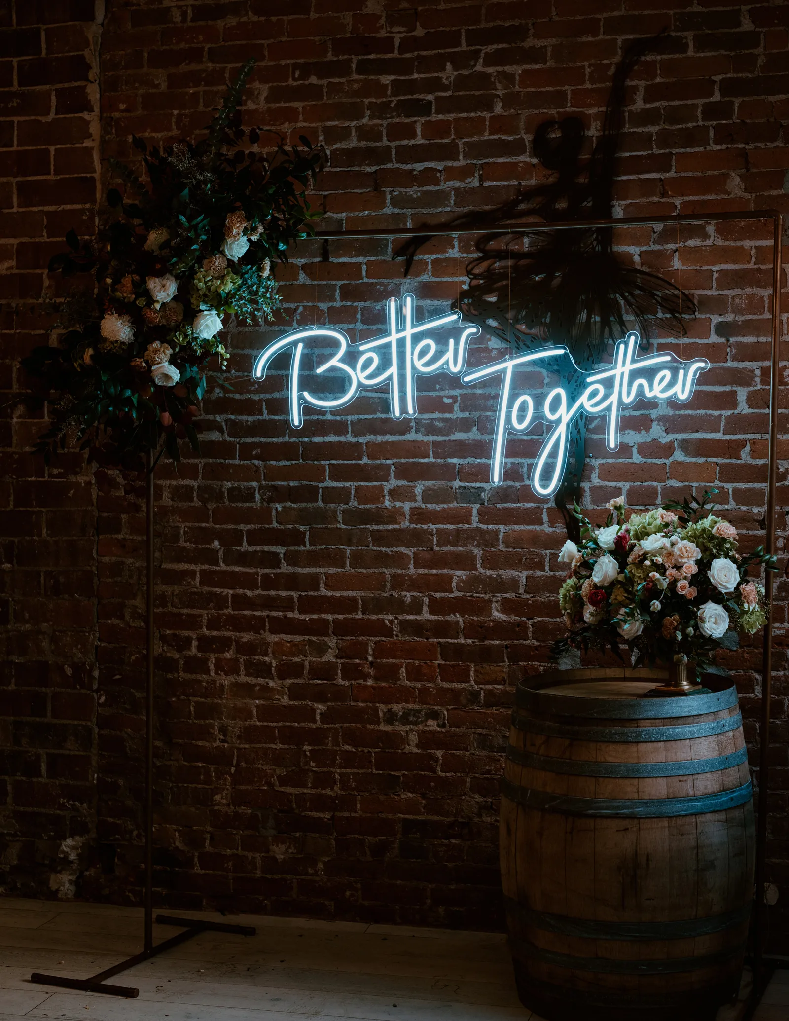 Photo of a neon blue sign that says "Better Together"