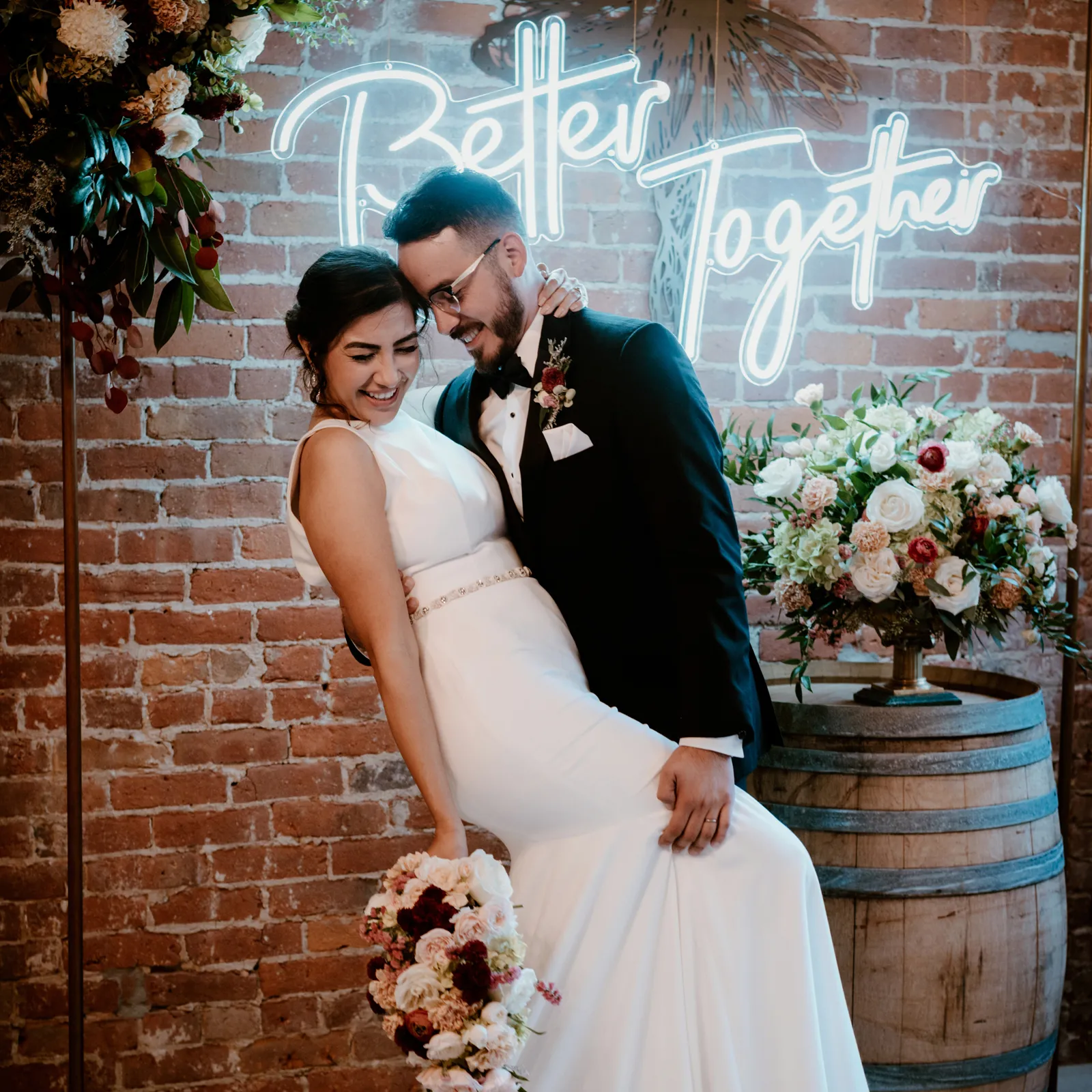 Groom tilting his bride about to kiss her.