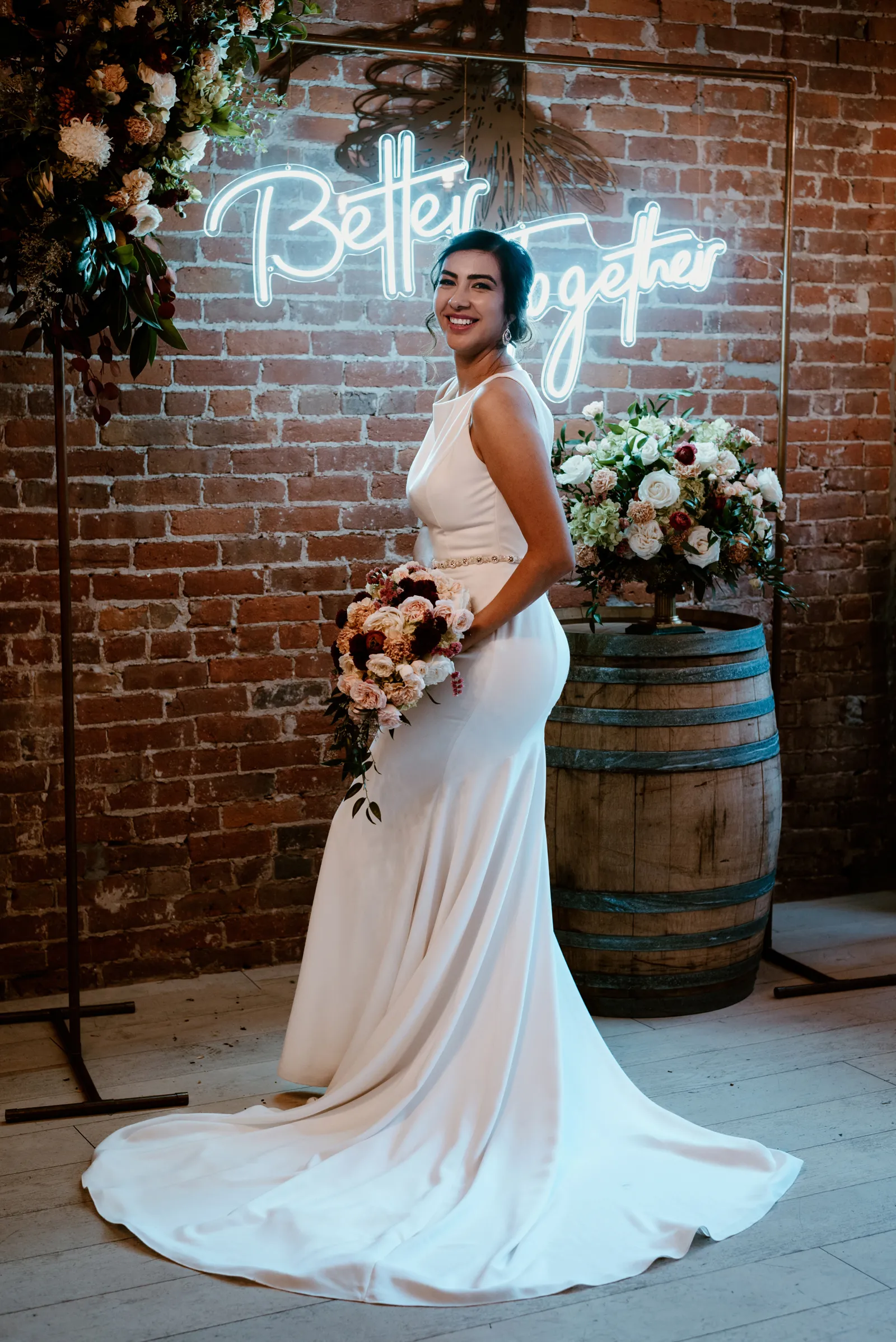 Bride smiling over her shoulder at the camera.