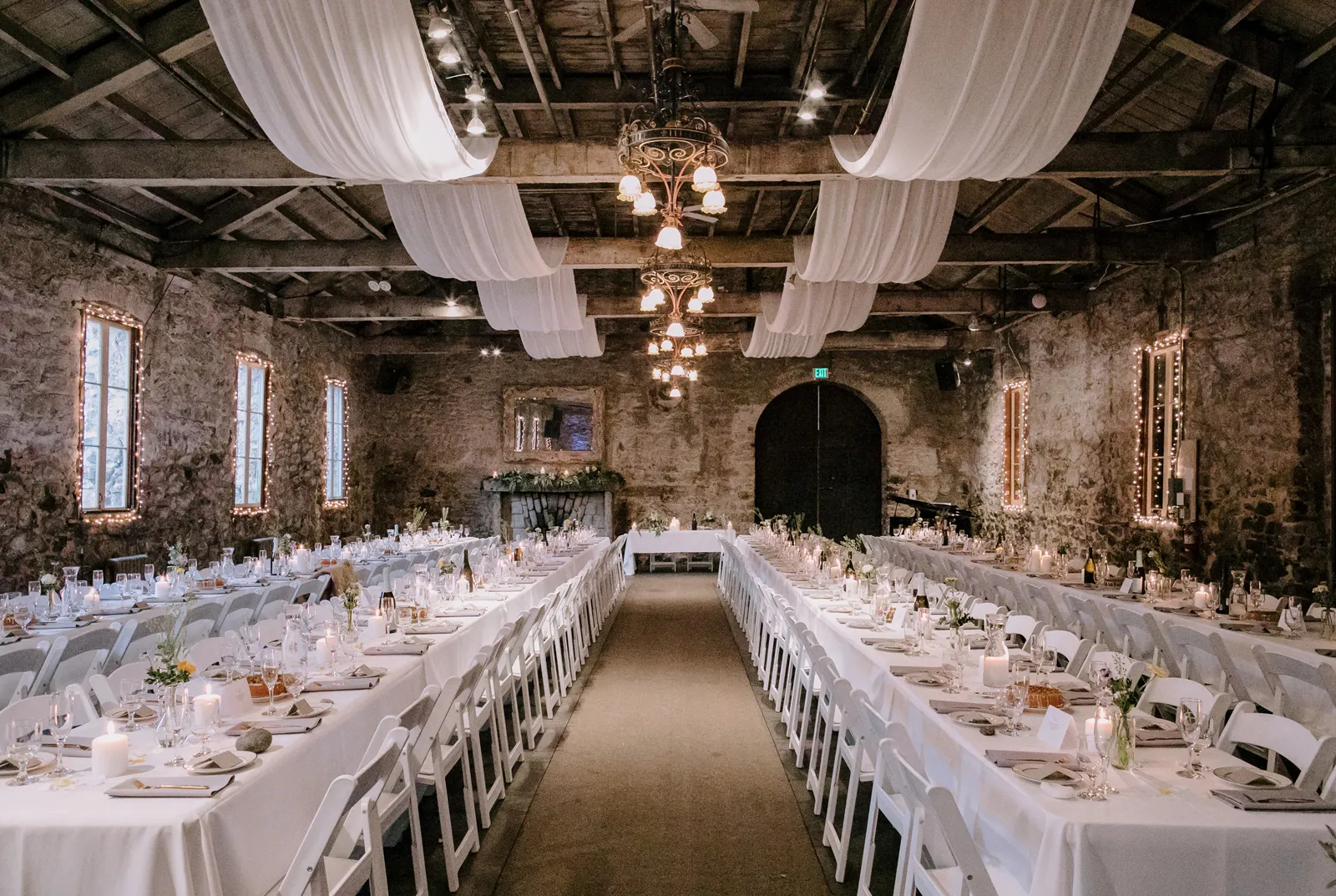 The Stone Room at Miner's Foundry in Nevada City, set with decor, table and chairs.