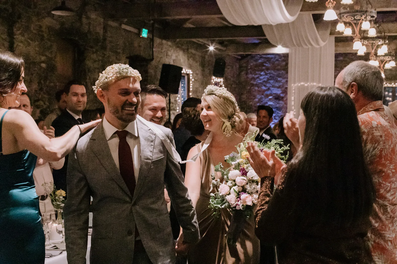 Bride and groom walking down the aisle together after saying "I do".