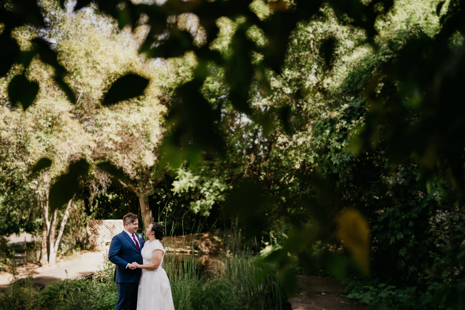 Far away photo of the newlyweds kissing.