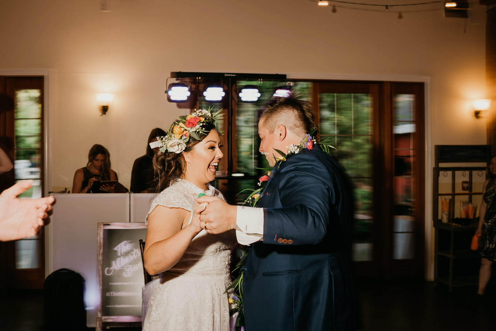 Newlyweds dancing together at their reception.