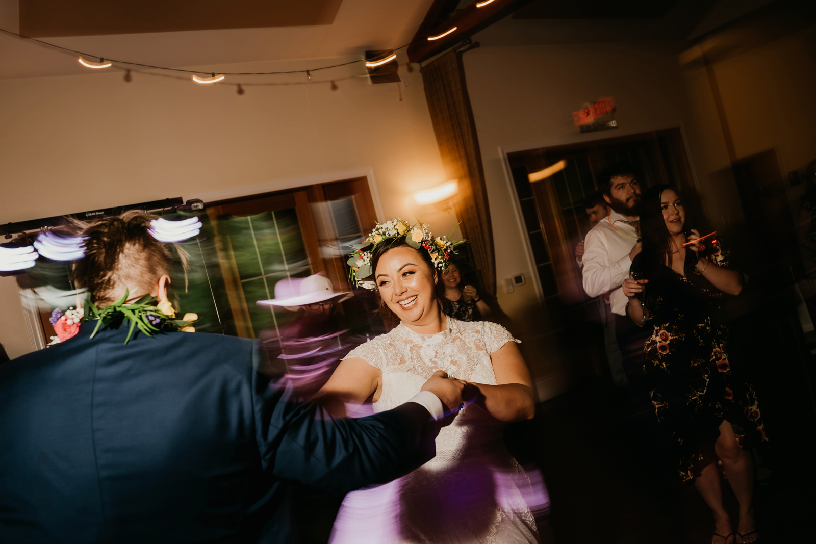 Bride and groom swirling around dancing.