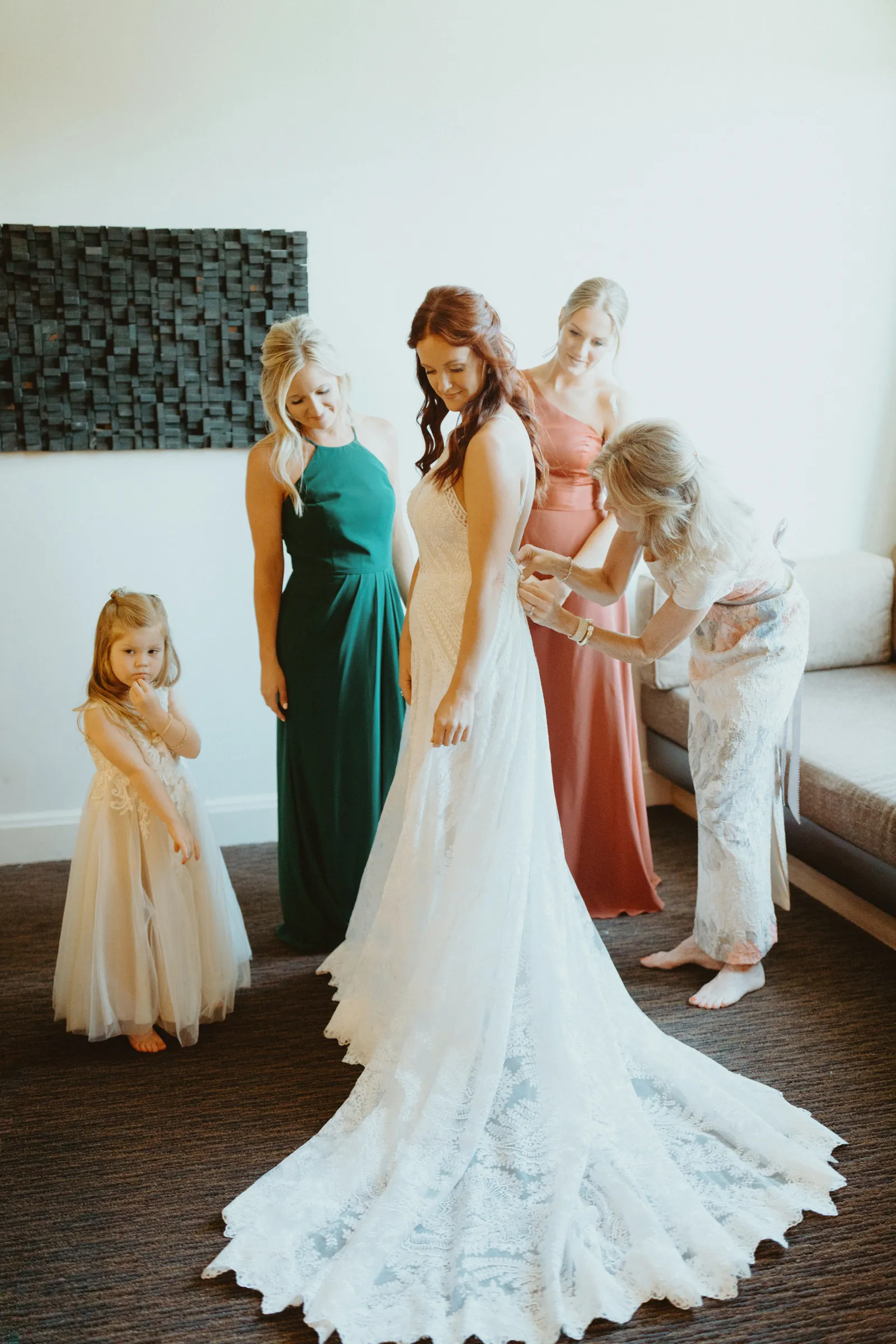 Bridal party surrounding the bride now that she is ready.