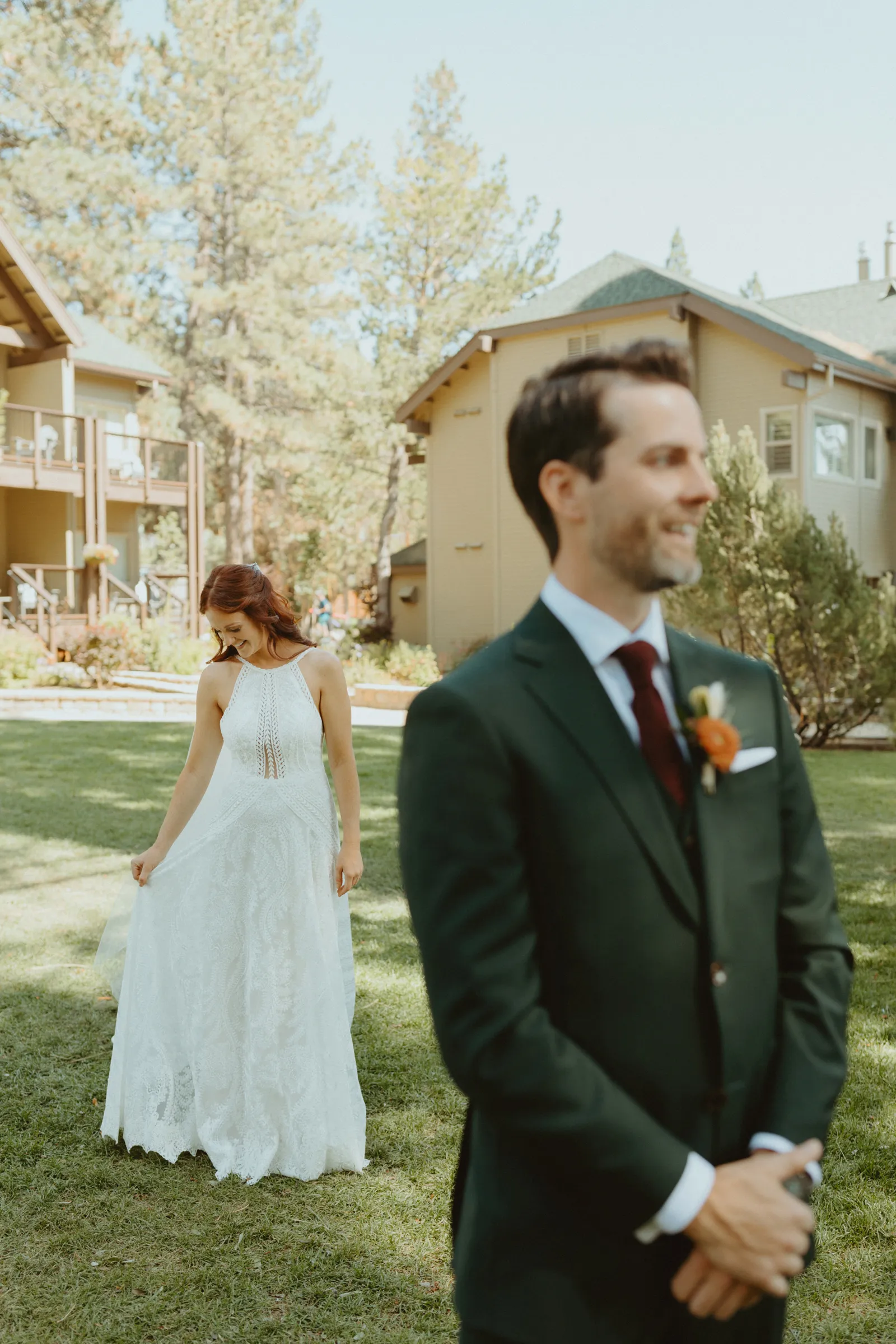 Groom waiting for his bride to show him her dress.