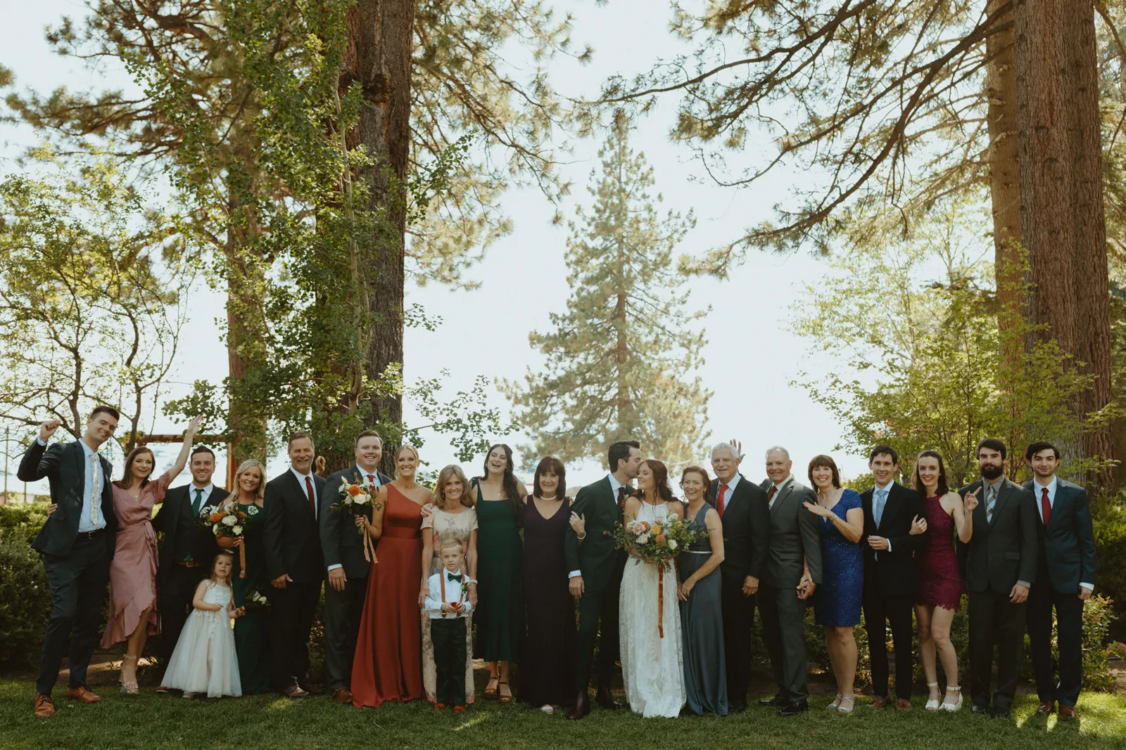 Bride and groom posing for a photo with all of their guests.