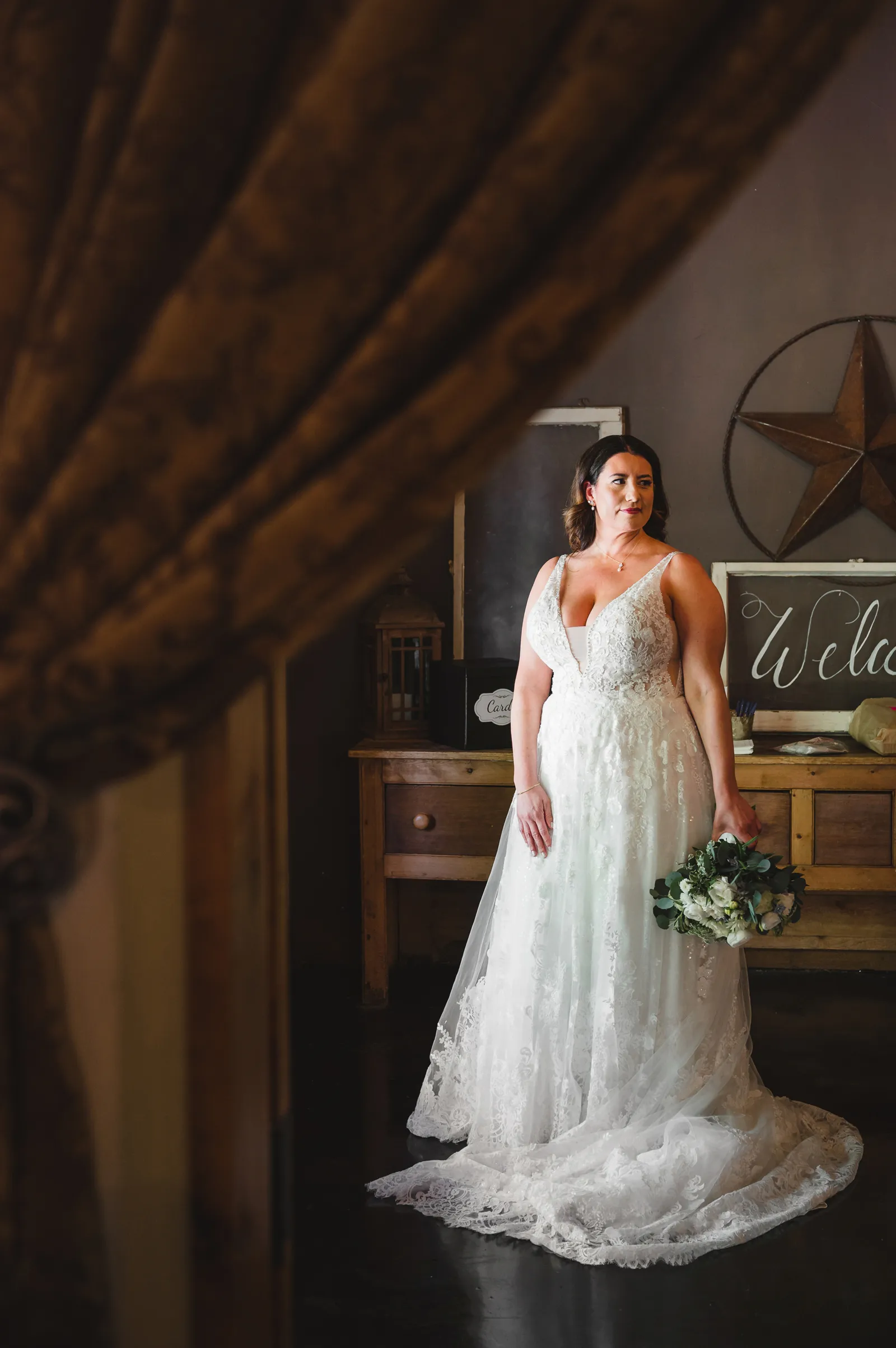 Bride posing with her flowers.