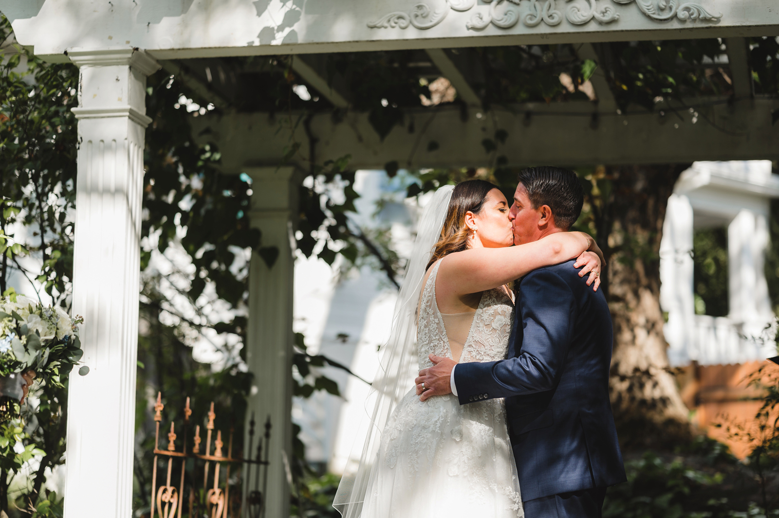 Bride and groom kissing after saying "I do."