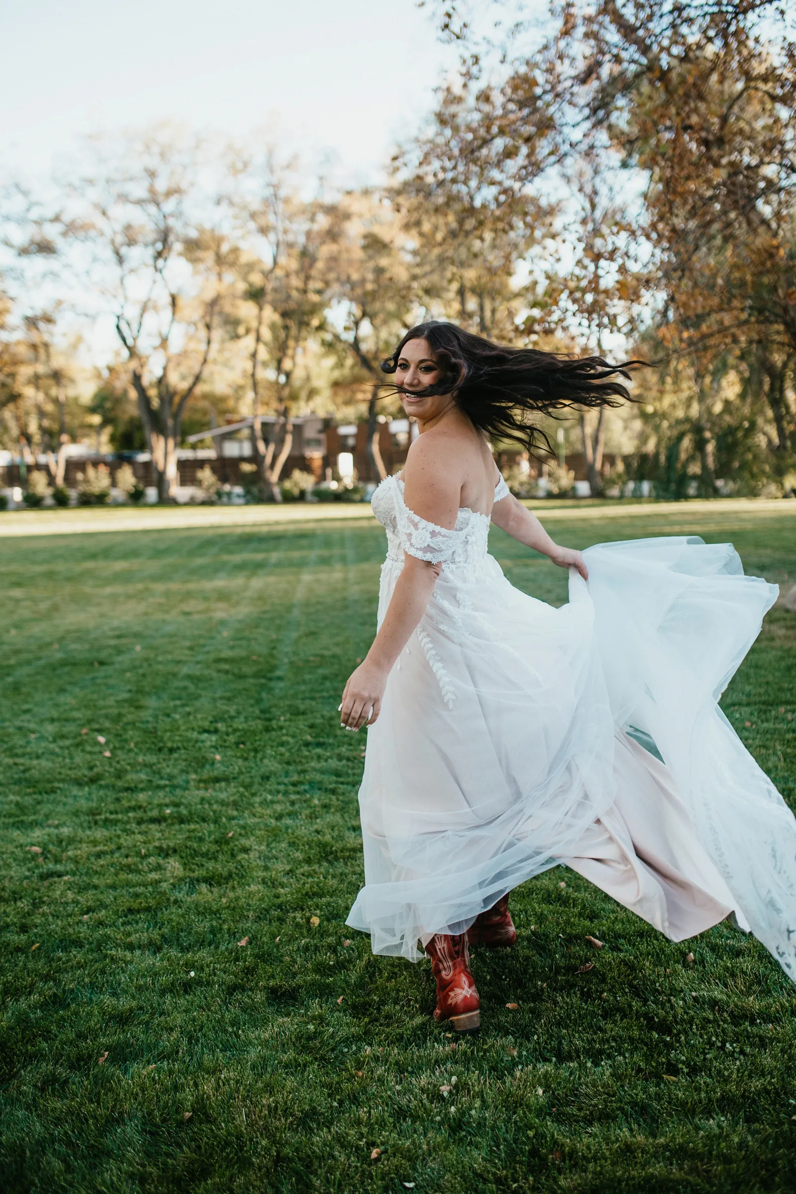 Bride twirling around outside.