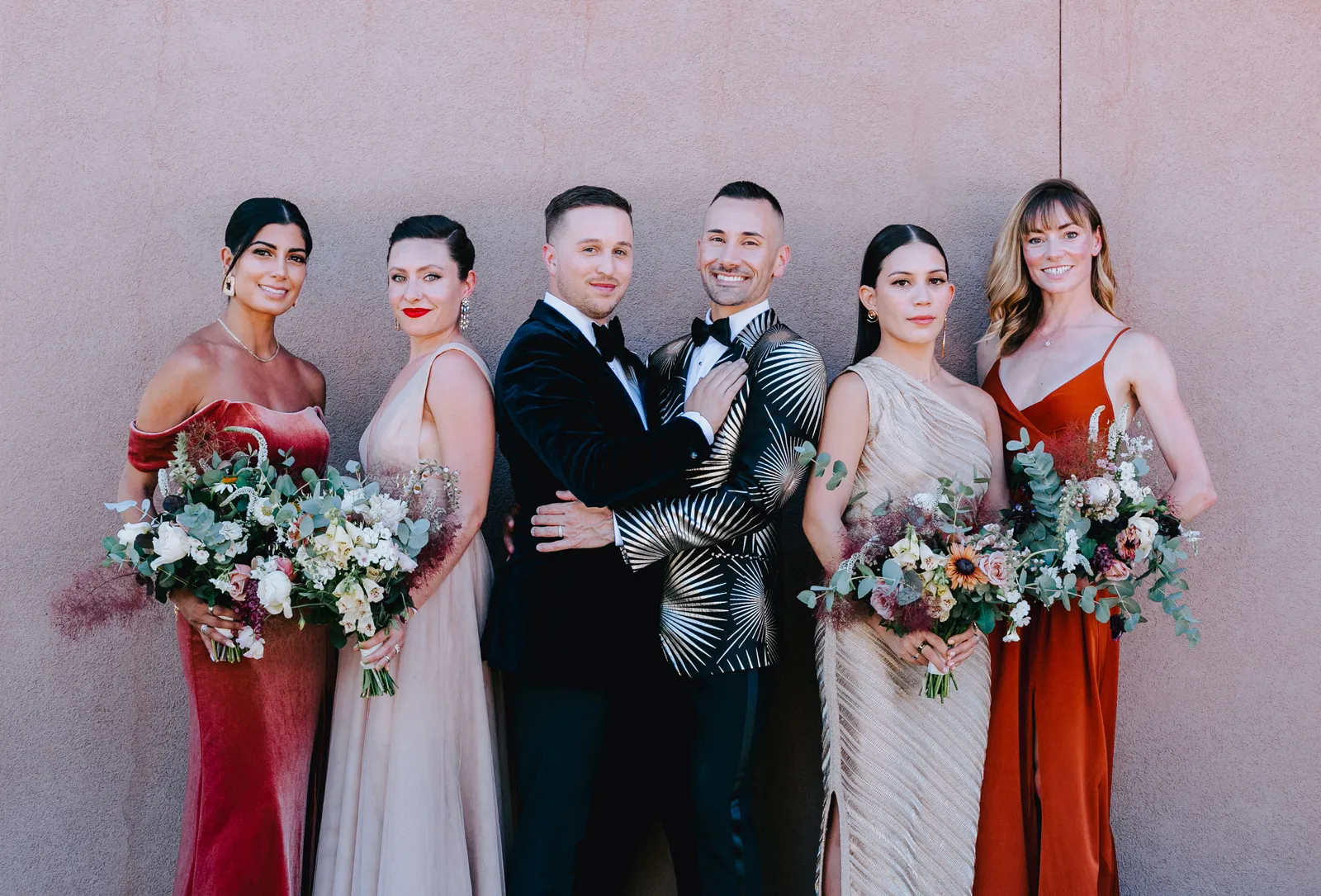 Grooms and their bridal party posing for wedding photos with Azara Images.