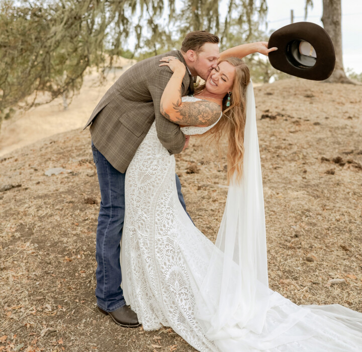 Newlyweds taking Boho Western Rustic wedding photos.