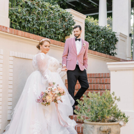 Bride being led up the stairs by her groom at Montalvo Villa.