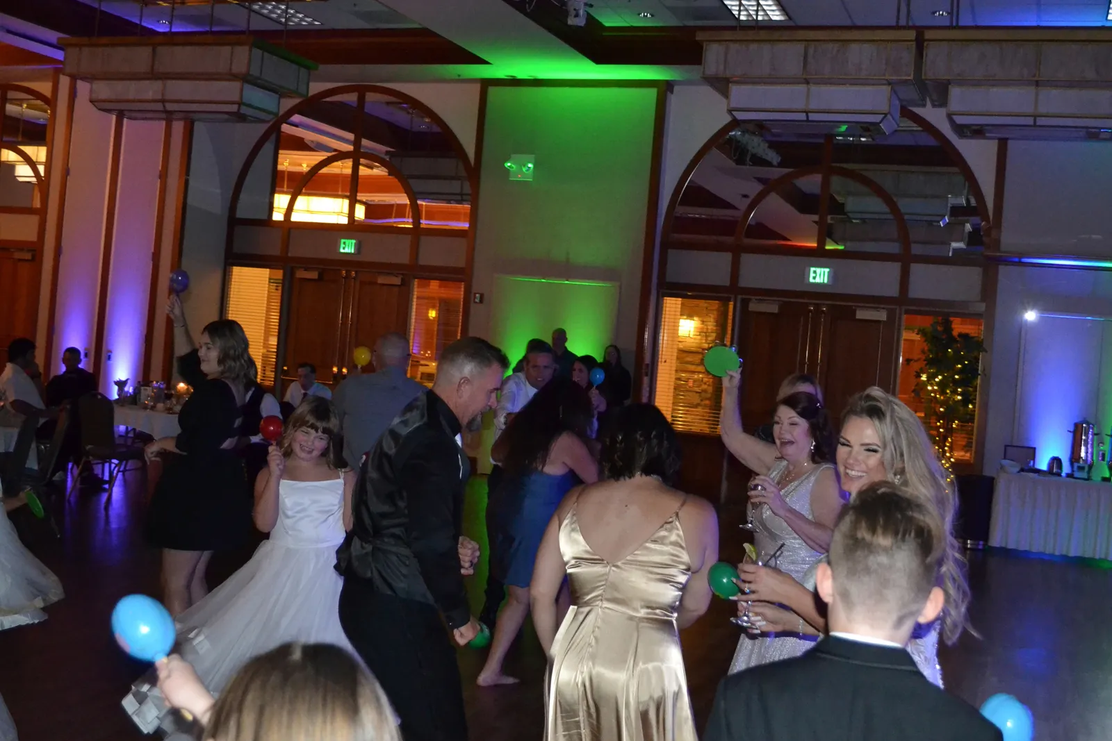 Wedding guests dancing to top wedding songs.