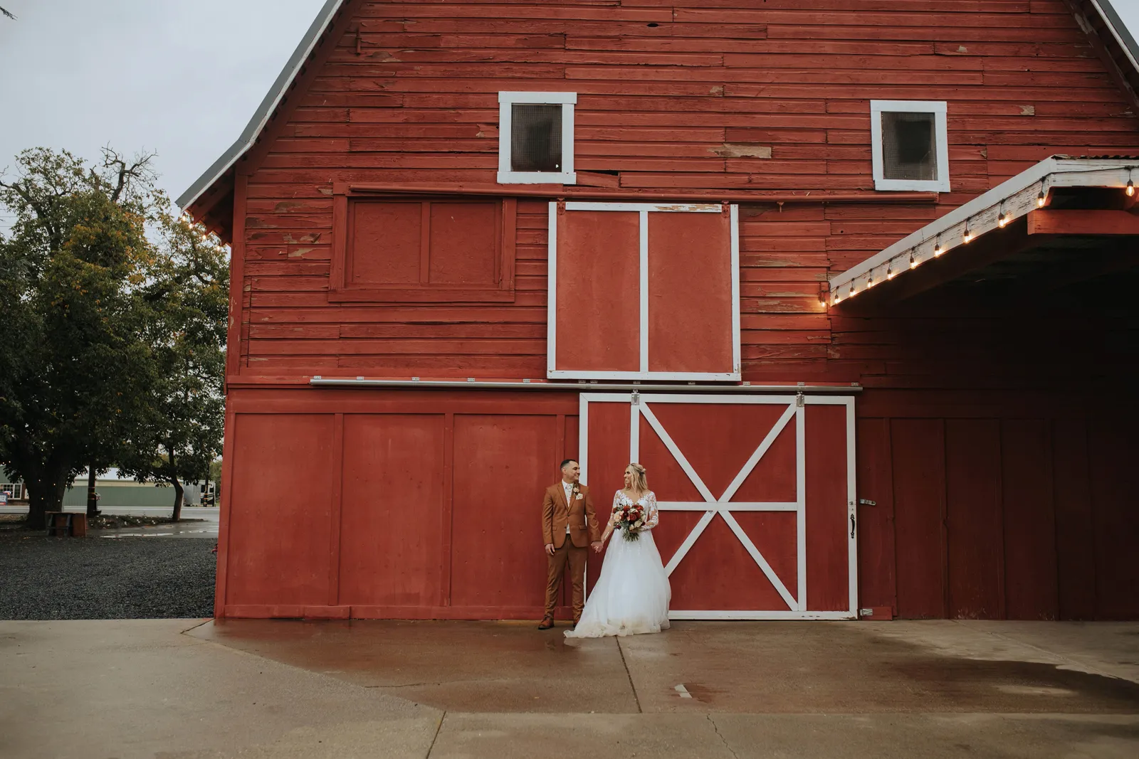 Bride and groom sharing their vows at their romantic outdoor wedding at The Red Barn.