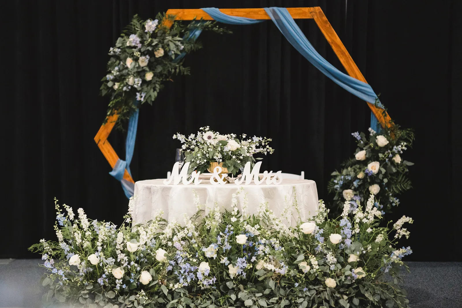 Sweetheart table at the elegant aviation museum wedding.