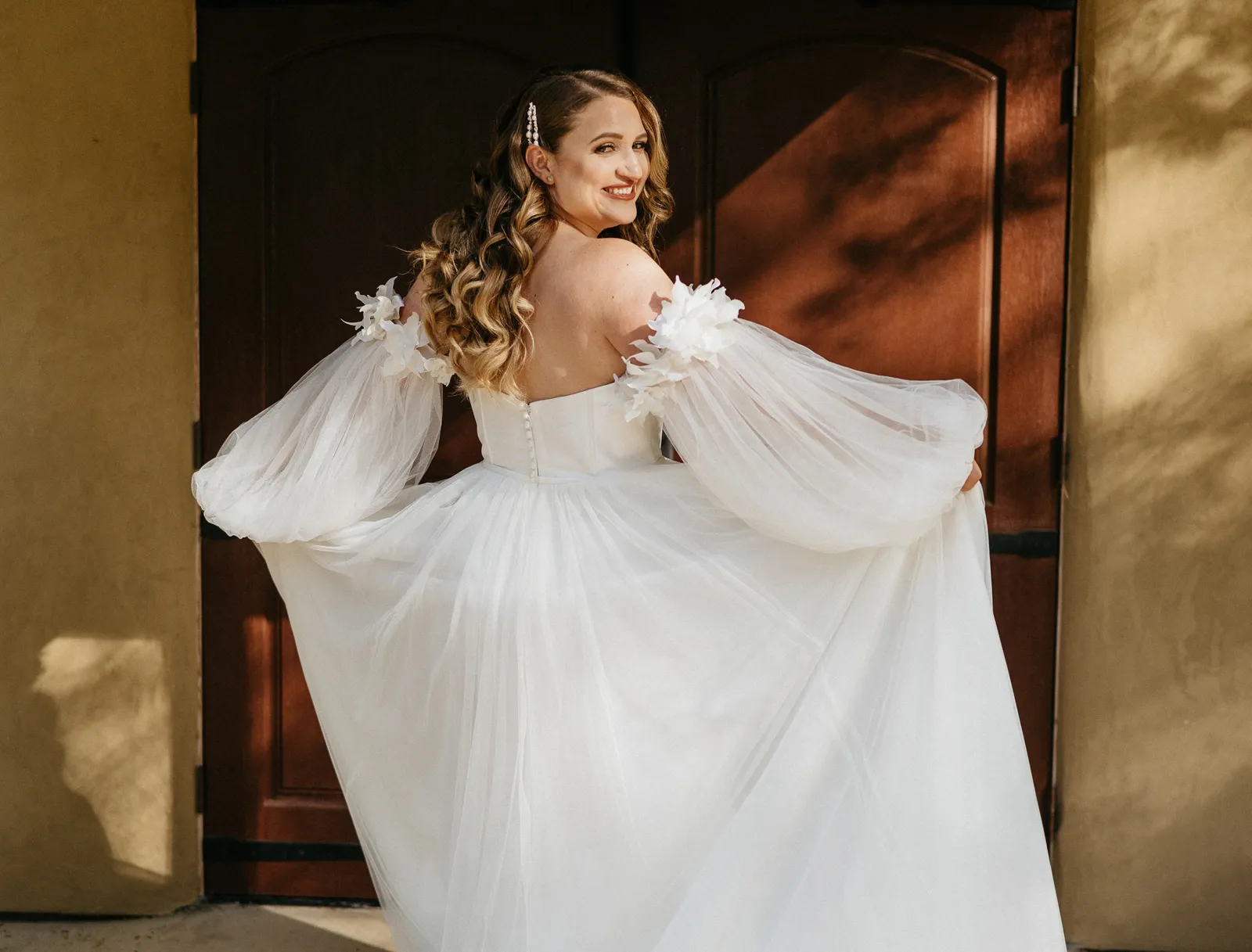 Bride twirling in her wedding dress at a submitted styled shoot at Rubidoux Ridge Vineyard.