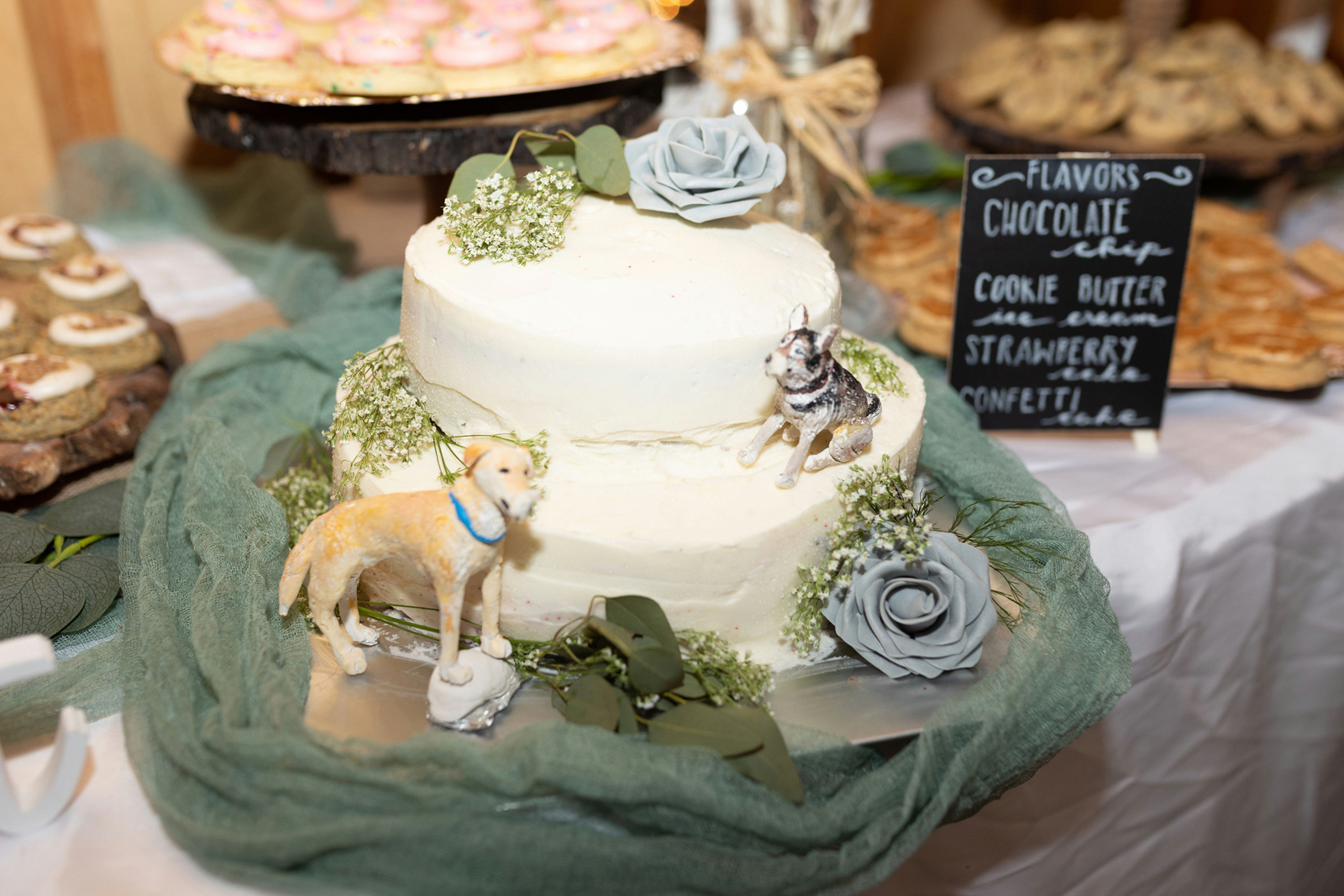 Wedding cake with dog figurines.