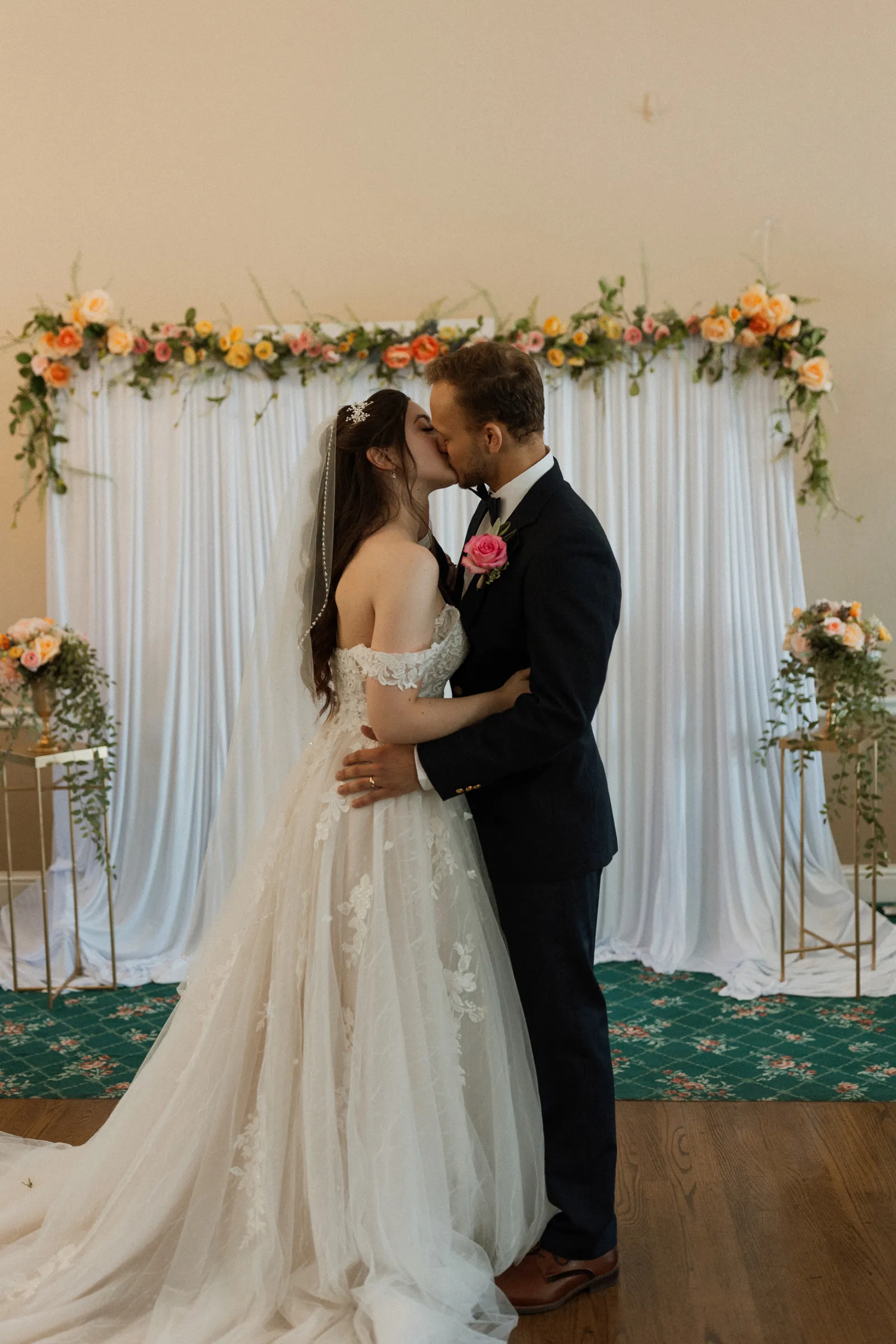 Bride and groom kissing after they say "I do."