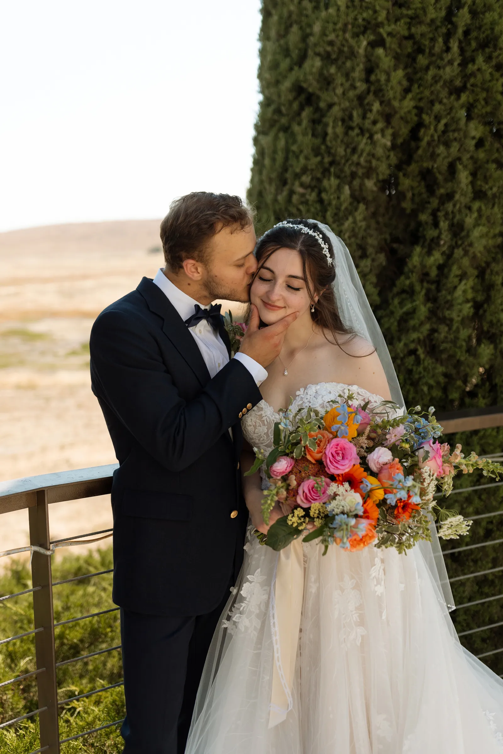 Bride and groom taking wedding photos at their beautiful estate wedding.