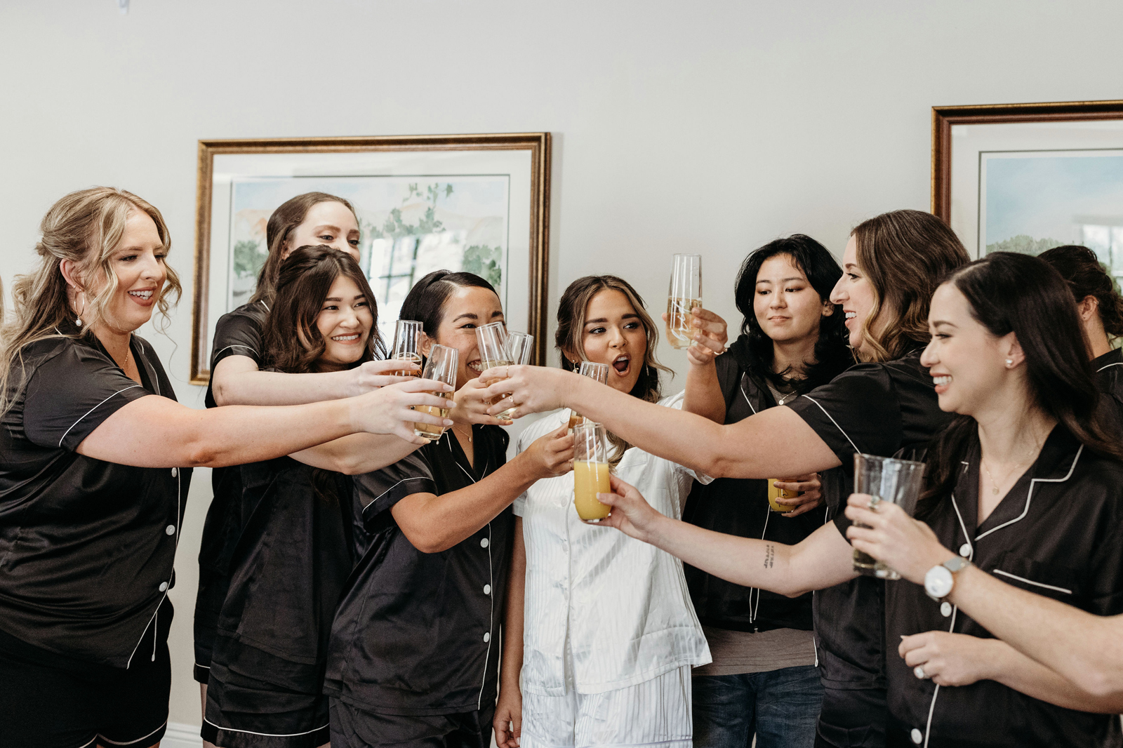 Bride and her bridesmaids getting ready together.