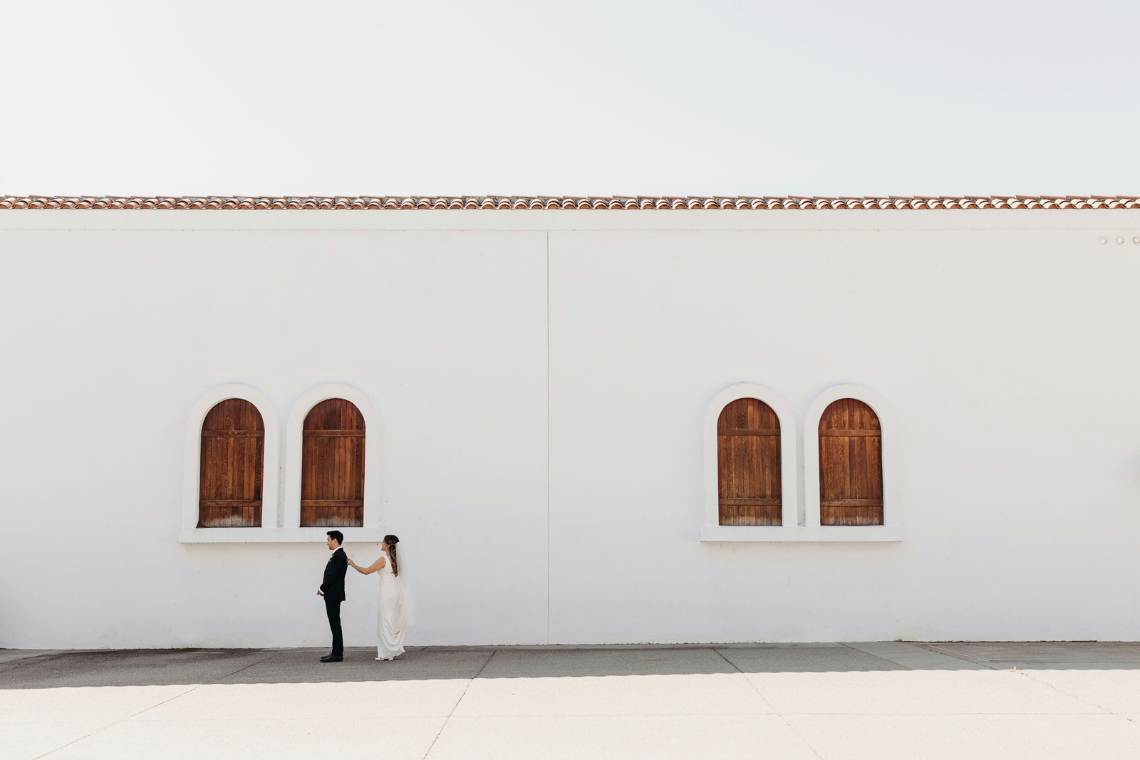 Bride and groom doing their first look at their winery wedding venue.