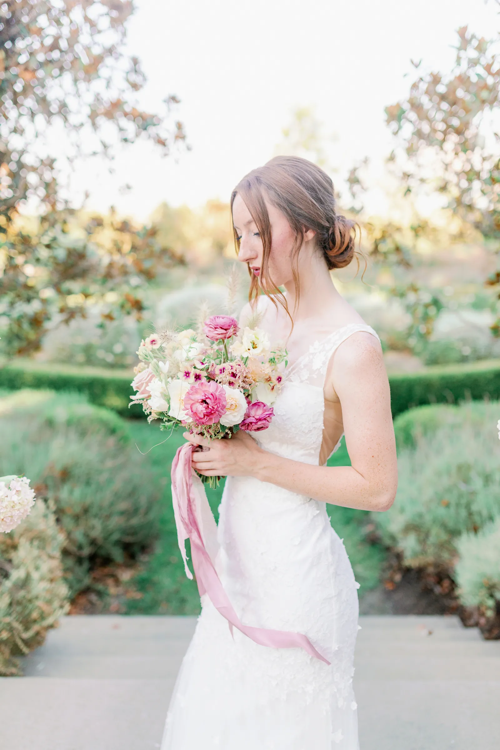 Bride posing at the altar at a whimsical spring wedding inspiration styled shoot at Park Winters. 