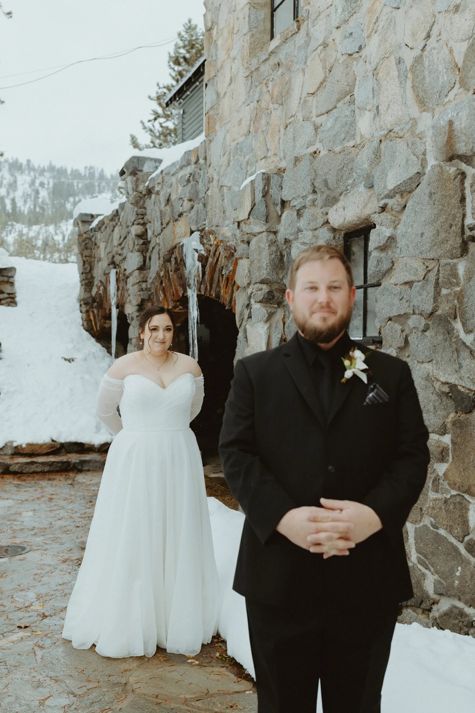 First look between Anna and Him at their Lake Tahoe ski lodge wedding ceremony.