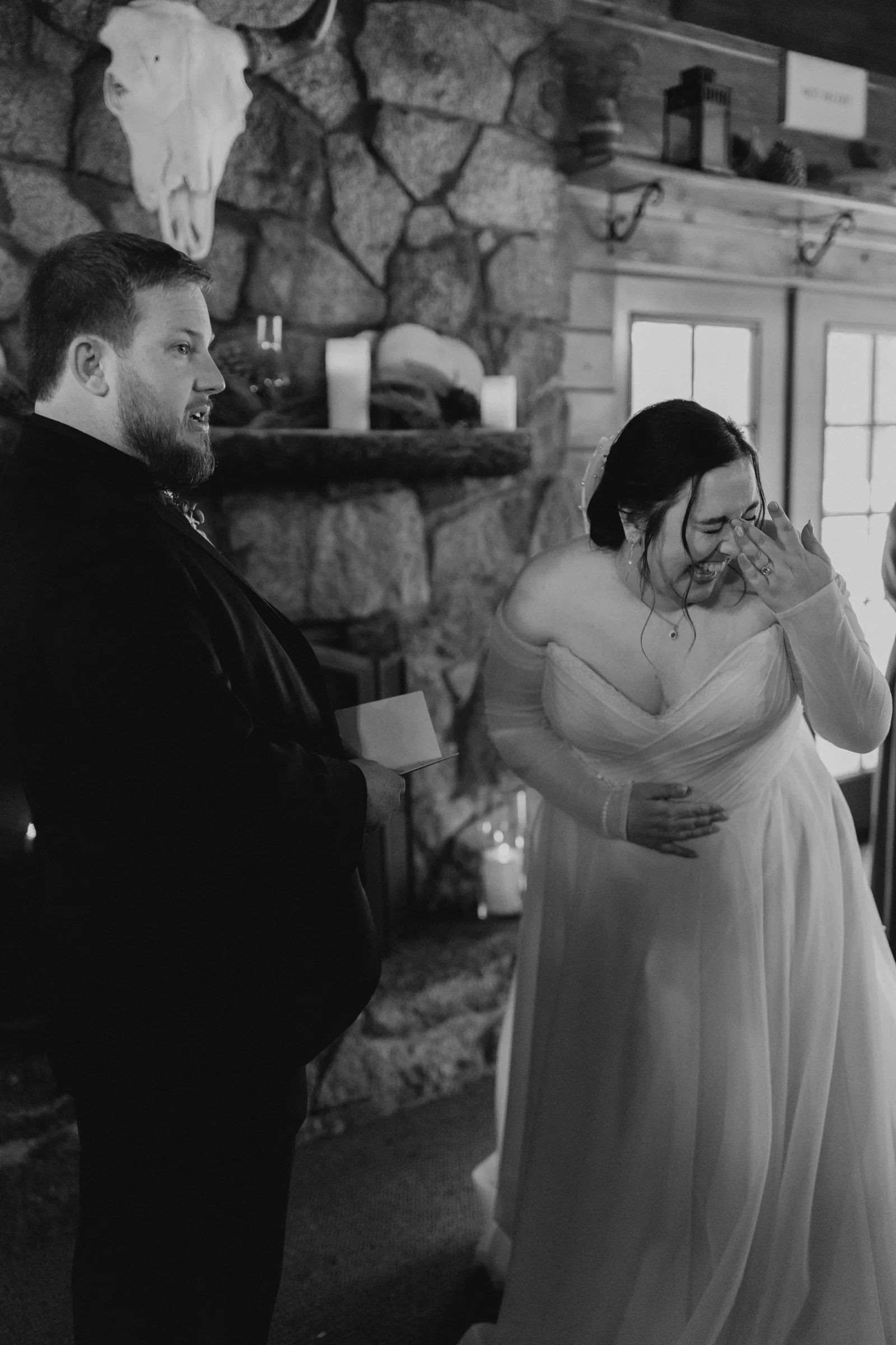 Bride laughing at the alter at her ski lodge wedding in Lake Tahoe.