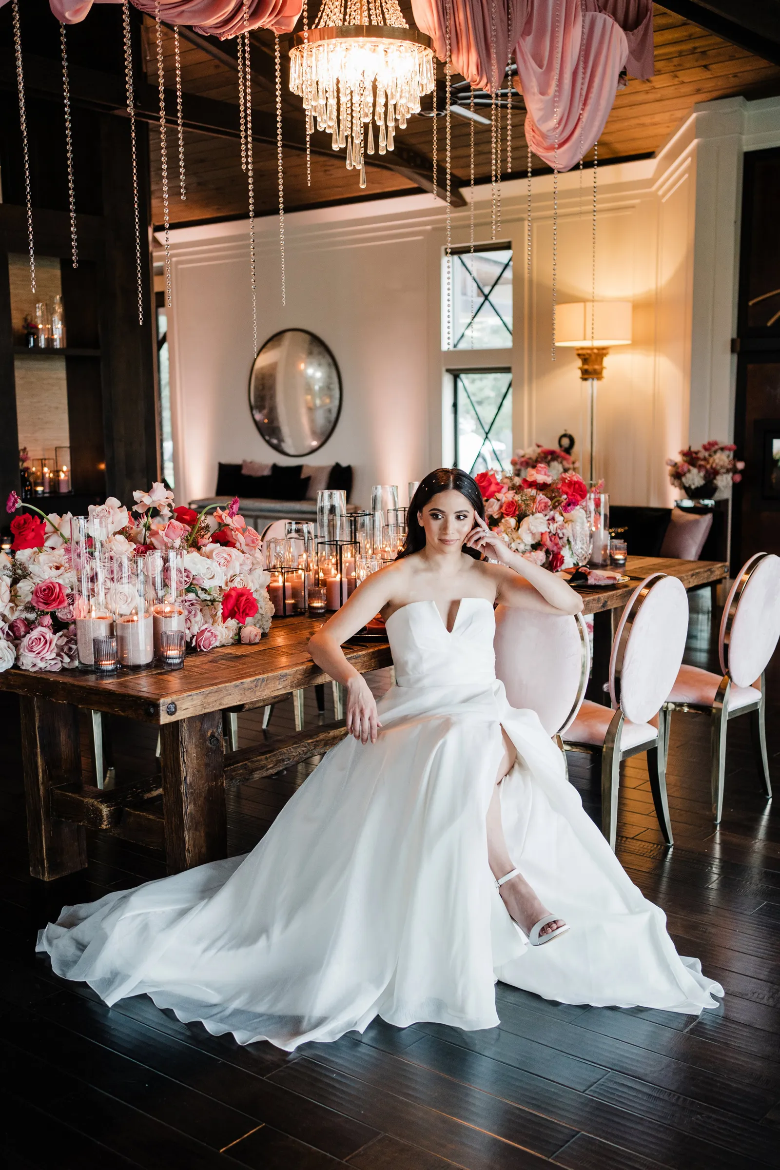 Bride sitting at her beautiful table set up at the Elegant wedding-inspiration styled shoot at The Ranch at Lone Oak Longhorns wedding venue.